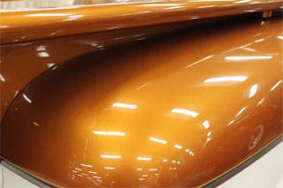 Hood painted with our Orange Copper candy over automotive paint black base.