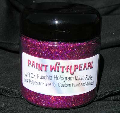 This Fushia or Hot Pink Hologram flake has a rainbow reflection in custom paint.